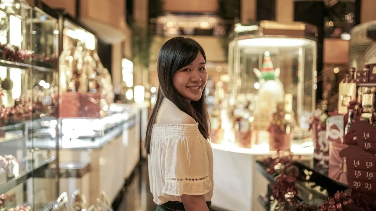 Photo of a smiling woman standing in a bright, modern apartment living room.