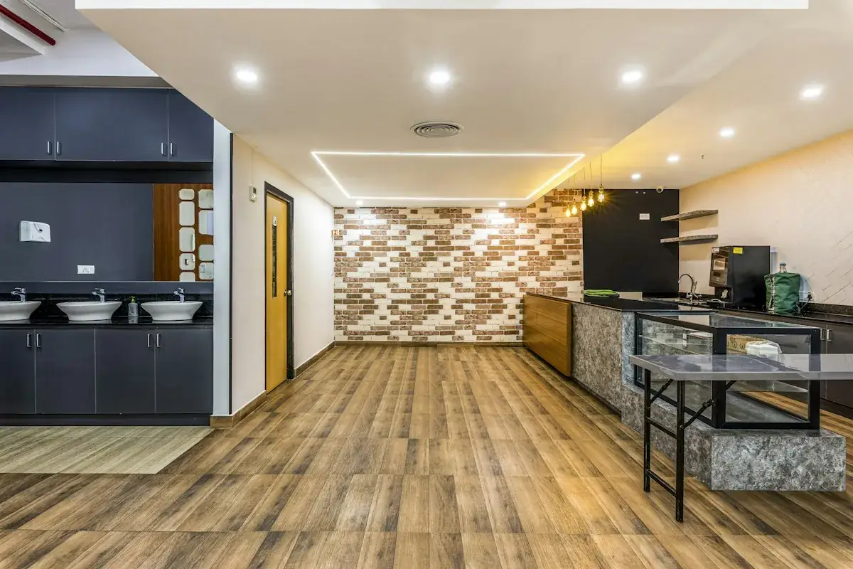 Bright studio apartment with cozy seating and kitchenette