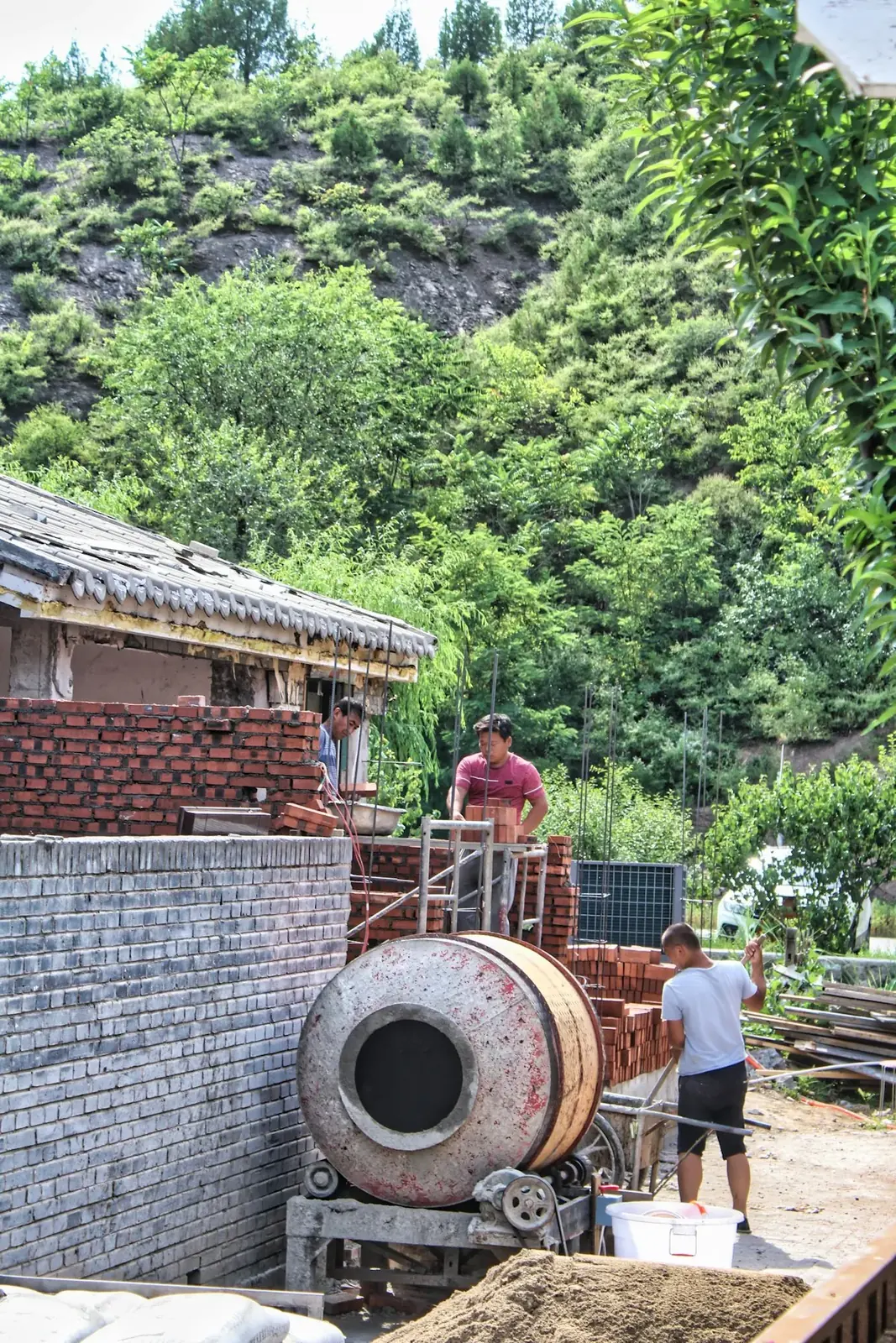 Construction workers skillfully laying bricks on a building site in Saint Vincent.